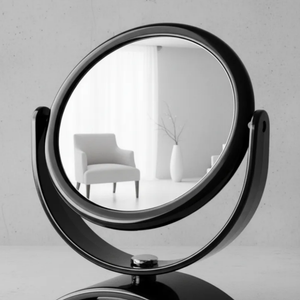 Espelho de aumento para maquiagem, redondo, de mesa, acabamento preto, em ambiente interno minimalista, foco no reflexo do espelho.
