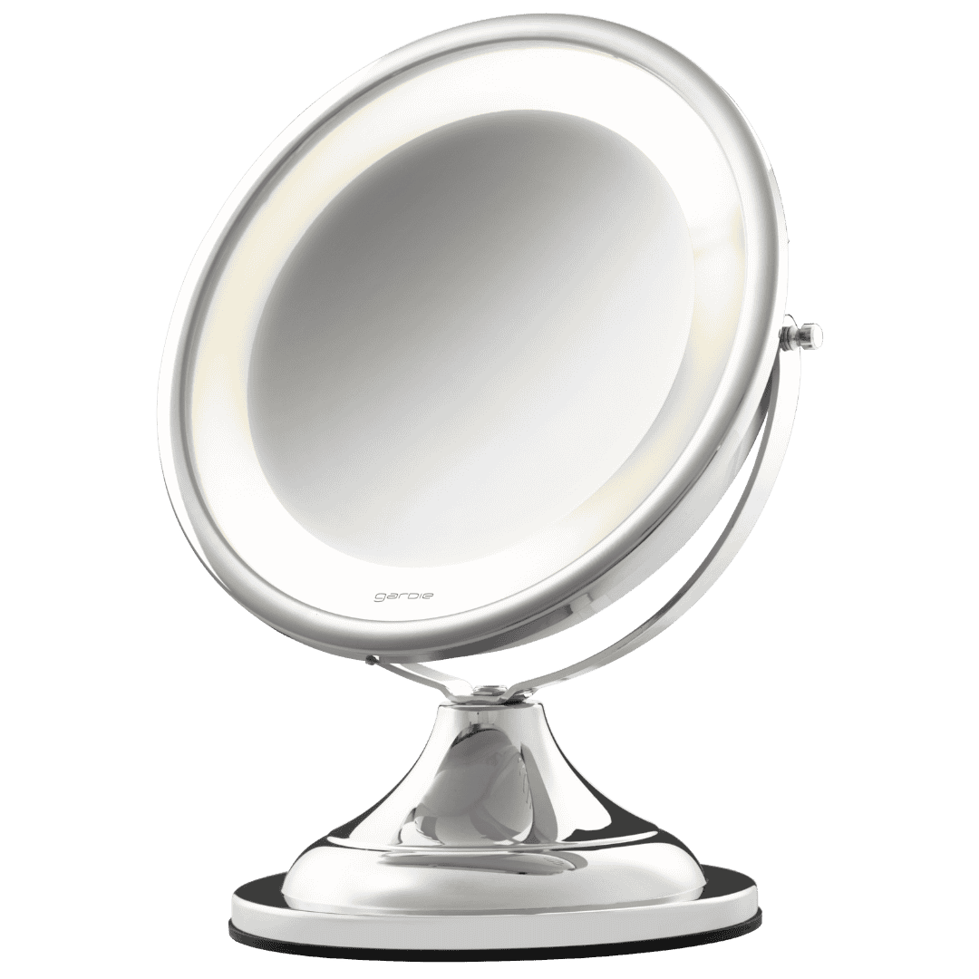 Espelho de aumento para cuidados faciais com Ø190mm e ponto focal de 30cm. Possui ring light com IRC 95%, bi-volt com 2 cores (quente e fria), base para balcão e rotaciona no eixo vertical.